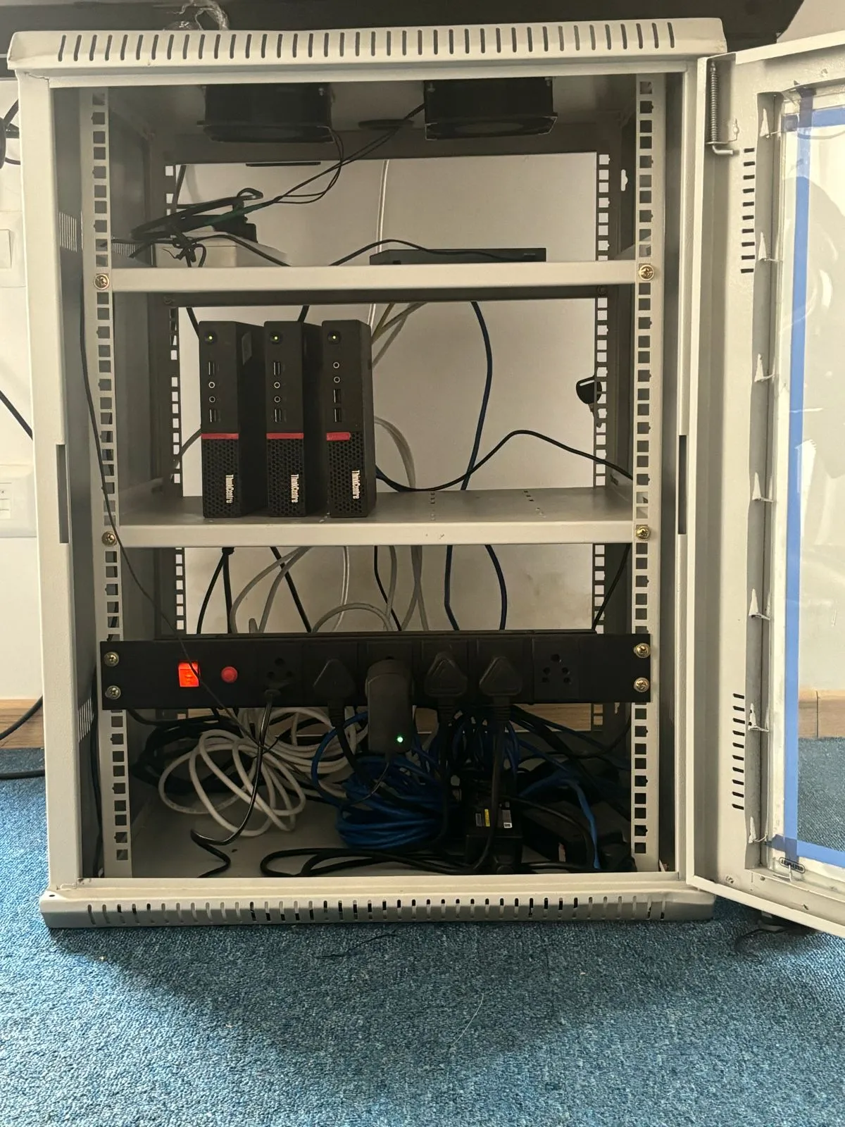 3-node home lab cluster setup showing Lenovo ThinkCentre machines in rack enclosure